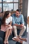 imgi_1_smiling-couple-looking-at-each-other-and-sitting